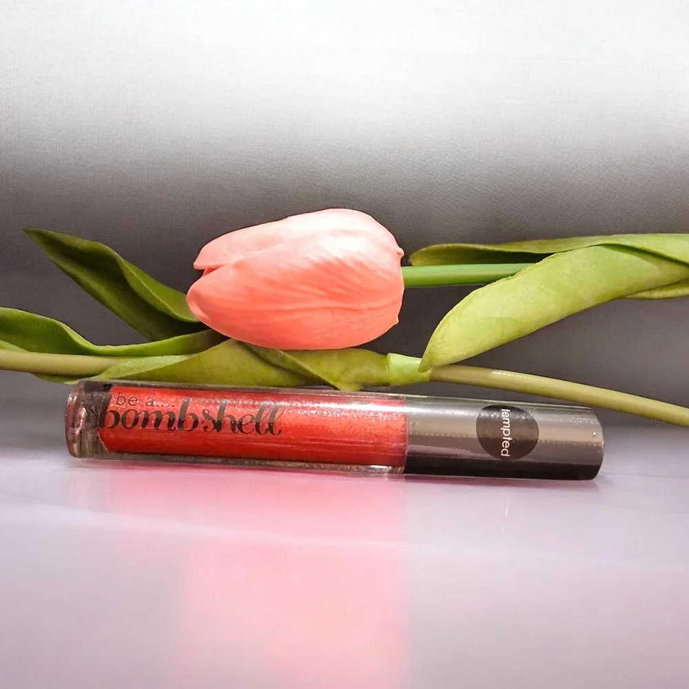 be a BOMBSHELL Shimmer Lip Gloss - Coral Red in The Color -Tempted